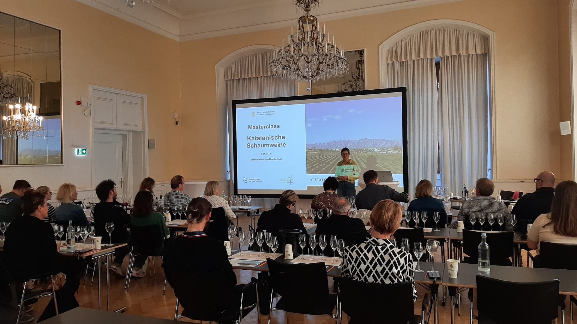 Nicole Wolbers leading a masterclass on Catalan sparkling wines for a professional audience.